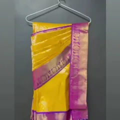 For easy storage and transport, I also offer hanger folding. This beautiful yellow and purple Kanjeevaram is perfectly pleated and hung, ready to be worn with minimal fuss.
