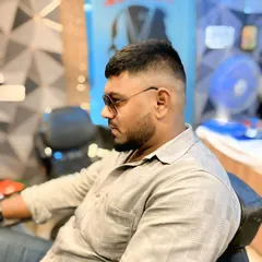 This angle highlights the clean fade and the shape of the haircut. It's a popular and versatile style that always looks good.