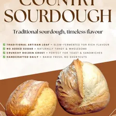 My Country Sourdough is a timeless classic. This promotional image highlights its key features: a naturally tangy flavor from slow fermentation, a crunchy crust perfect for toast, and the fact that it's handcrafted daily with no added sugar.