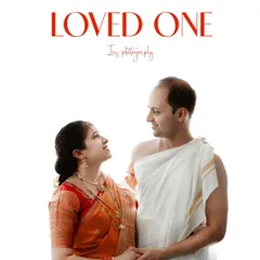 A classic portrait of a couple dressed in traditional South Indian attire for their child's naming ceremony. The clean, white background puts all the focus on their happy expressions.