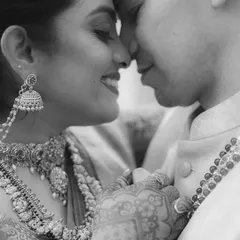 The same intimate moment in black and white. Stripping away the color focuses the viewer's attention on the pure emotion and connection between the couple.