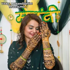 A playful and happy bride showing off her detailed mehndi. Her joy is infectious.