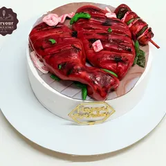 Believe it or not, this is a cake! I designed this to look like a plate of tandoori chicken for a client who wanted a truly unique and surprising birthday cake. Everything you see is completely edible.