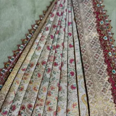 The beauty of a saree is in its pleats. Here is a close-up of perfectly arranged pleats on a beautiful floral saree, a key detail I focus on in my draping.