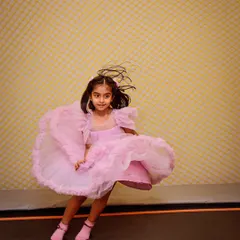 A princess twirling and jumping on the trampoline. The play zone is designed for active fun and letting out all that energy.