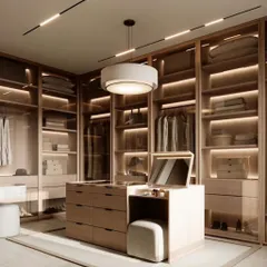 I create walk-in closets that are a whole vibe. This example shows an island vanity with built-in storage and a makeup station, surrounded by warm, wood-framed glass wardrobes with integrated lighting.