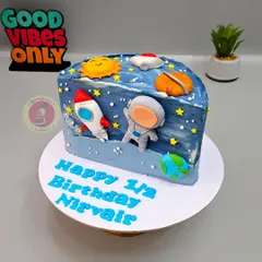 A space-themed half-birthday cake for little Nirvair. This half-cake design is perfect for celebrating the six-month milestone.