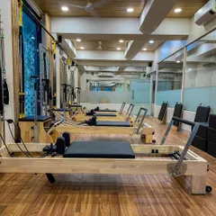 The studio space is designed to be open and inviting, with large mirrors that help you check your form and alignment during classes.