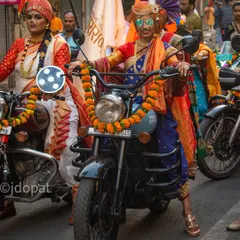 This photo captures the blend of modern style and tradition, with a rider wearing sunglasses and a colorful turban as part of the Gudi Padwa celebration.