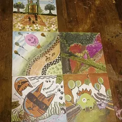 A close-up of the six unique canvases created by one group during a Canvas Carousel event. It's amazing to see the diverse styles and ideas that come together.
