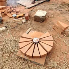 Wedge-shaped bricks are cut and arranged to form the central part of the dome's pattern, showcasing the geometry and craftsmanship involved.