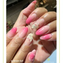 We specialize in 3D nail embellishments, including sculpted floral details combined with a soft pink ombre and heart patterns for a romantic, textured finish.