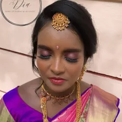 Another view of the Seemantha makeup, focusing on the eye work. The shimmery eyeshadow and long lashes make her eyes pop, while the traditional bindi and maang tikka complete the look.