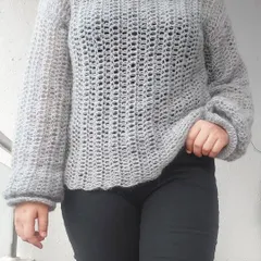 The semi-sheer mesh stitch of the Vevitha Sweater makes it a great piece for layering over a camisole or tank top.