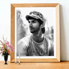 This is a memorial portrait of Sushant Singh Rajput, framed to show how it would look as a physical piece of art. It was created as a tribute by special request, capturing a quiet moment.