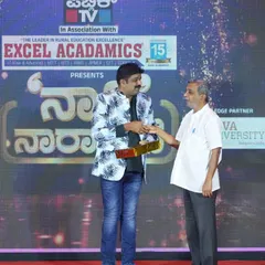Shaking hands with an organizer at the Public TV and Excel Acadamics event. It was a well-organized program celebrating rural education.