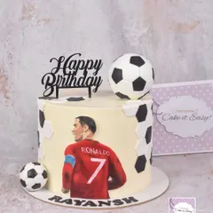 For a young football fan, we created this dessert table centered around a hand-painted Ronaldo cake. The main cake is decorated with buttercream and features a detailed, edible painting.