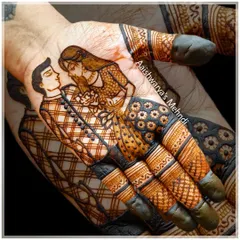 A close-up of a romantic couple portrait on the palm. I focus on capturing the emotion and details, from the groom's checkered kurta to the bride's jewelry, making it a true piece of art.
