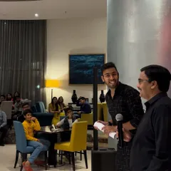 Here I am engaging with the audience at a corporate gathering. My performances are a great way to break the ice, get people talking, and add a memorable, high-energy element to any professional event.