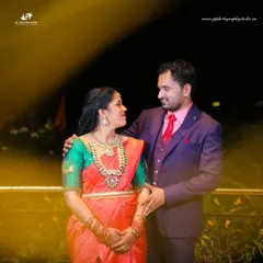 A romantic nighttime portrait of the couple. We use ambient lighting to create a warm, intimate atmosphere for our reception and engagement photos.
