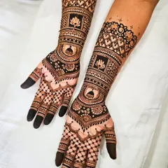 A symmetrical design for both arms, featuring lotus motifs and architectural domes. The dark, solid fingertips are a classic bridal choice.