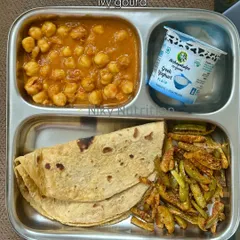 A classic North Indian combination, this meal includes sprouted flour chapati with channa masala (chickpea curry), sautéed ivy gourd, and Greek yogurt.
