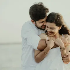 A candid moment of laughter and affection by the water. My goal is to make you feel comfortable enough to let your genuine personalities shine through, resulting in natural couple portraits like this.