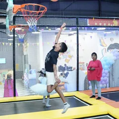 Who says you need to be 7 feet tall to dunk? On our trampoline basketball court, everyone can feel like a superstar as they bounce high for the perfect slam dunk.