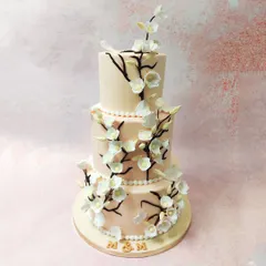 A full view of the cherry blossom cake, a sophisticated and timeless choice for a wedding celebration.
