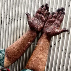 The result of my organic henna paste after two days. This deep, rich maroon stain is what I promise and deliver. It's achieved without any harsh chemicals, just pure, natural ingredients and proper aftercare.