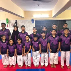 A group photo of our students in their team shirts. We foster a sense of belonging and teamwork in every class.