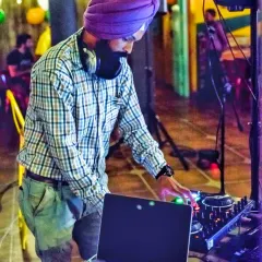Focused on the mix during a live set. Being an artist means constantly searching for new sounds and creative ways to blend tracks together.