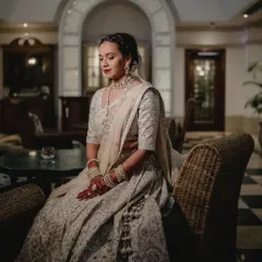 Before the ceremonies begin, there's a moment of quiet reflection. I always suggest we find a calm corner to create these timeless, editorial bridal portraits. Here, under soft lights, the world slows down. It’s a chance to capture the bride's serene beauty and the quiet anticipation of the journey ahead, creating a frame that feels like a love letter to this moment in time.
