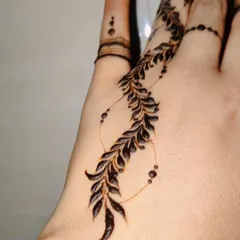 Another angle of the self-love henna, showing how it gracefully follows the curve of the hand.