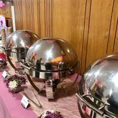 Another view of the Women's Day buffet. The shiny cloches and pink table runner created a cheerful and celebratory atmosphere for the special day.