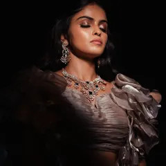 A moment of quiet contemplation. I used dramatic, focused light to highlight the intricate details of her jewelry and the serene expression on her face, creating a powerful and artistic portrait.