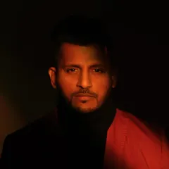 A more dramatic shot from a recent photoshoot. The lighting here creates a mood that reflects the deep, emotive power of music.