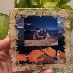Another angle of the custom resin photo frame, held against a natural background. It's a perfect way to preserve a cherished memory.