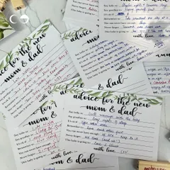 A collection of heartfelt and humorous "Advice for the new mom & dad" cards filled out by guests. This is one of my favorite interactive activities, creating a wonderful keepsake for the parents to be.