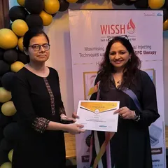 It is an honor to train fellow practitioners in advanced dermatological techniques. Here, I am presenting a certificate of completion at a hands-on workshop I led on GFC therapy, sharing my expertise to elevate our collective skills.