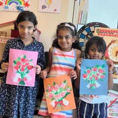 Three happy artists with the beautiful flower bouquets they painted. Using cotton buds to create the roses was a fun technique that they all mastered perfectly.