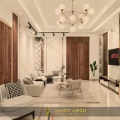 Another view of the Rajnagar Extension living room, this time focusing on the seating arrangement. The design features a mix of textures, a modern chandelier, and a sophisticated color palette, creating a luxurious yet comfortable atmosphere.