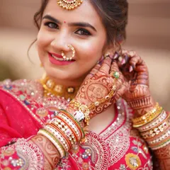 A detailed shot of this bride's radiant makeup. You can see the flawless base, soft flushed cheeks, and the subtle shimmer on her lids.