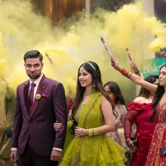 A dramatic entrance with colored smoke bombs. This shot shows how I can create a vibrant and energetic atmosphere for your event photos.
