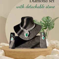 Two looks, one masterpiece. This diamond set is shown here with the vibrant emerald stone, offering a classic and regal look that can be easily swapped for a different mood.