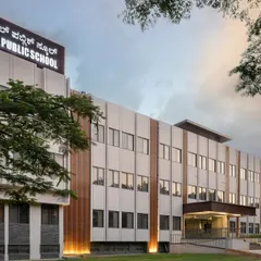An angled view of the Jindal Public School, showing the rhythmic pattern of the facade panels and windows. The design provides a sophisticated and empowering environment for learning, reflecting our commitment to architecture for social change.