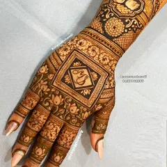 A personalized back-of-hand design with the initials "MS" in a central square. The design is surrounded by intricate floral patterns and features swans on the wrist.