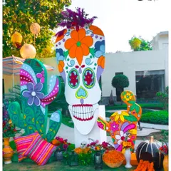 This larger-than-life 'sugar skull' was a central photo-op for a Mexican-themed party. I designed it with bold, floral patterns and paired it with colorful cacti props to create a memorable installation.