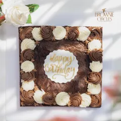 This isn't your average birthday cake. It's my signature fudgy brownie, scaled up for a party and decorated with rich chocolate and vanilla buttercream rosettes. A dream come true for any true chocolate lover's celebration.
