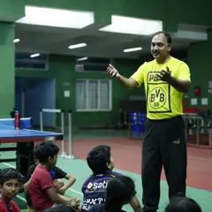 Head Coach Krunal Telang addressing our young players during a group session, emphasizing the core principles of hard work and smart training.
